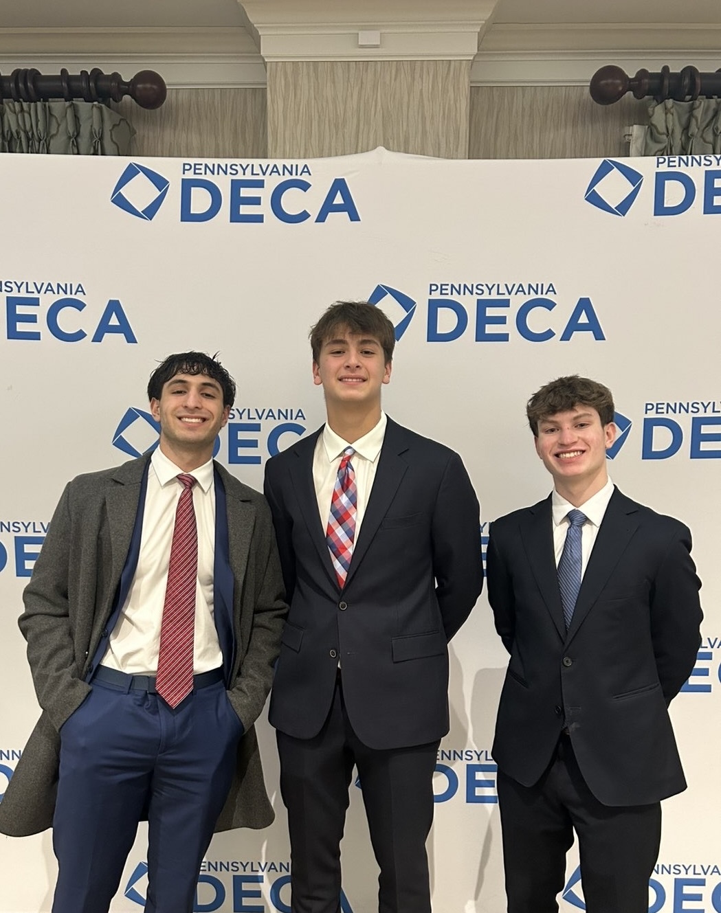 The three Teach It Forward founders together at the Pennsylvania DECA conference